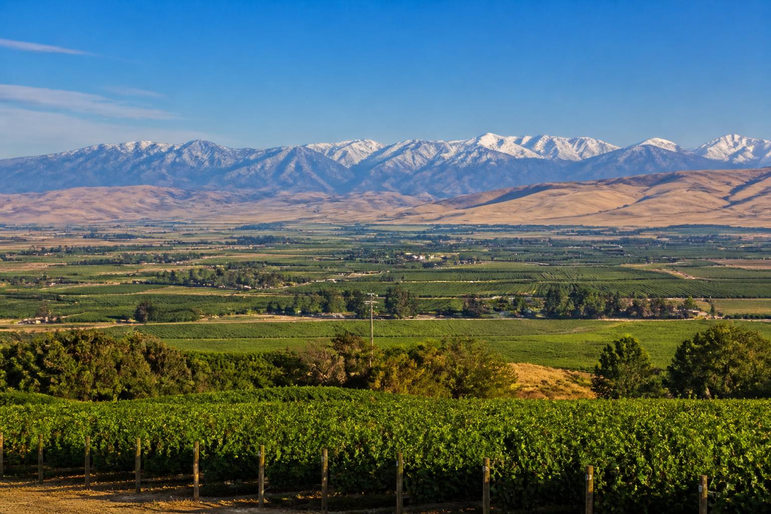 The San Joaquin Valley near Fresno, California, with fertile farmland and the snow-capped Sierra Nevada in the distance